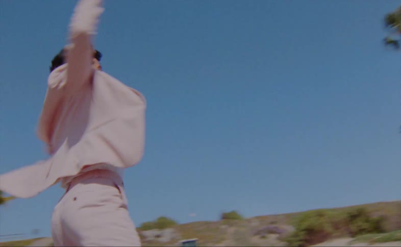 A view of a man dancing outdoors