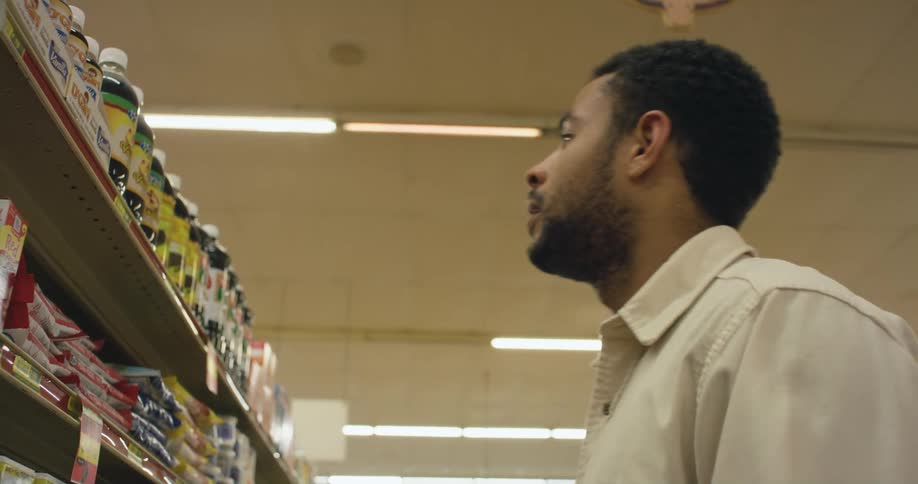 A man is shopping in a super market store