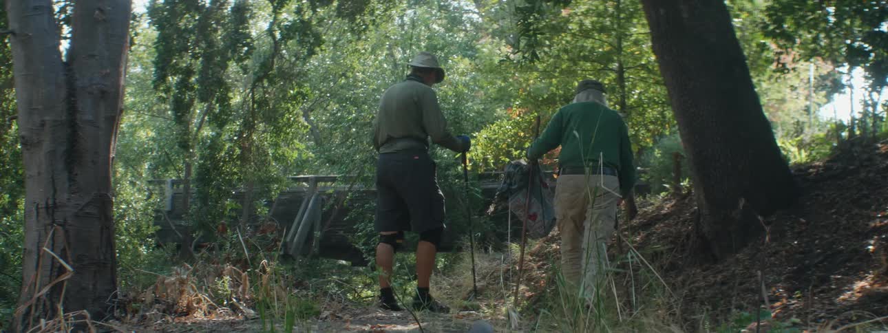 Two men are hiking through the wilderness