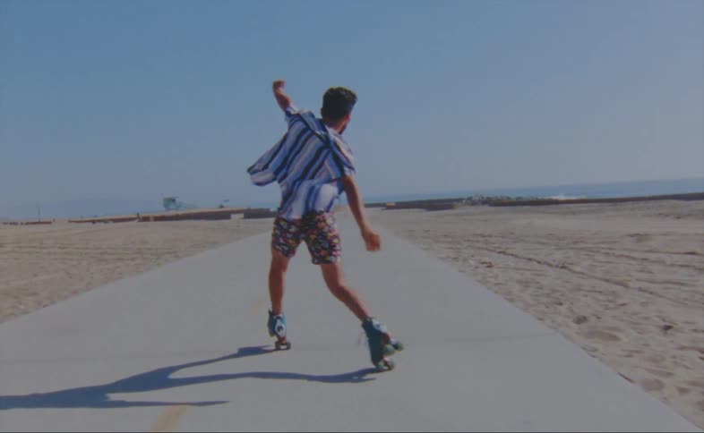 A man dancing outdoors on skates
