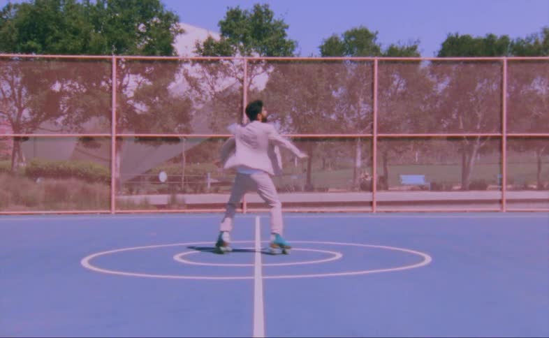 A man dancing on skates outdoors