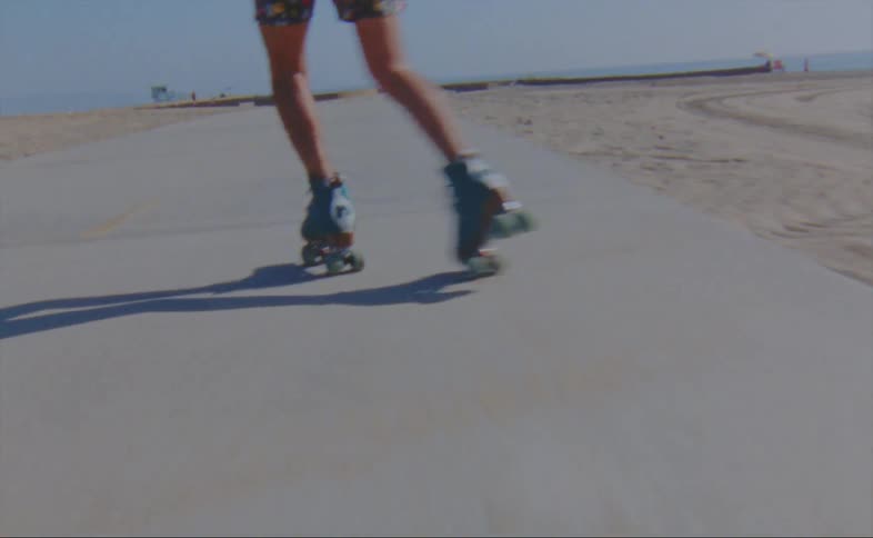 A person is roller skating on the boardwalk