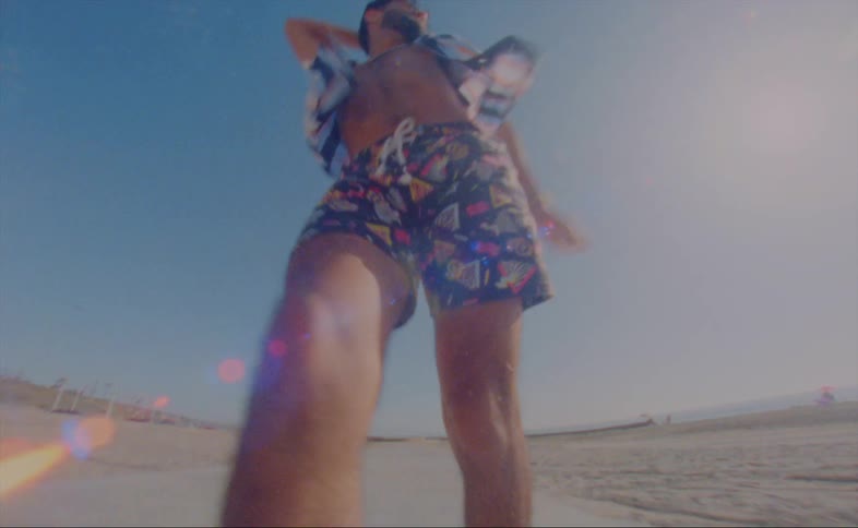 A man is skating at the beach during spring