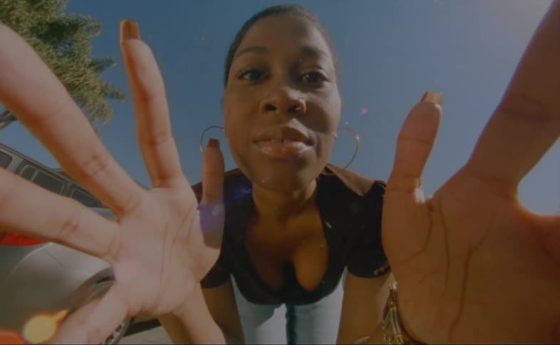 A woman is holding the camera with her hands