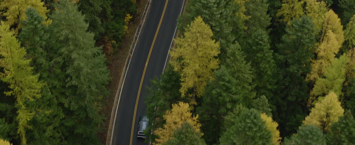 A car travels solo on back roads