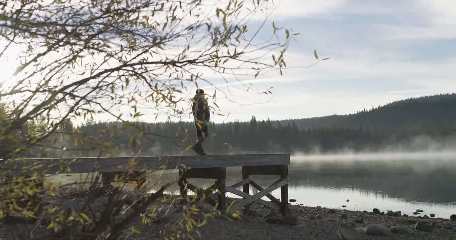 A person walks on a dock