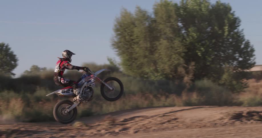 A person rides a bike in the dirt