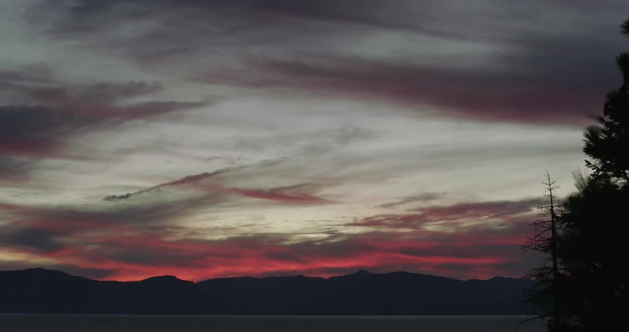 Time lapse of clouds moving in the sky at dawn