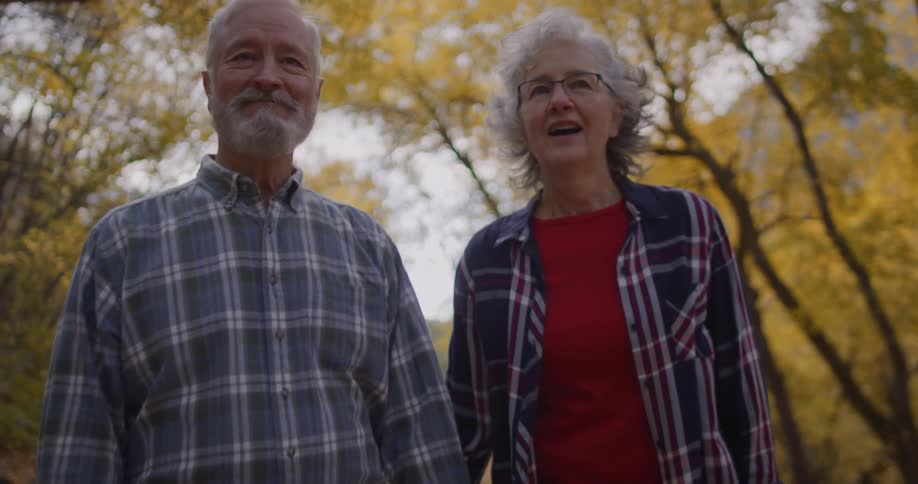 A couple are hiking in the forest