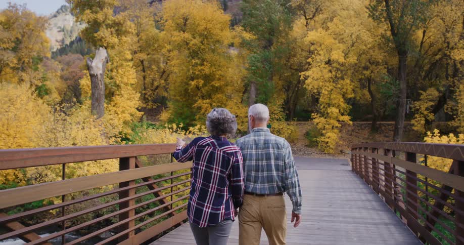 A man and woman walking outdoors