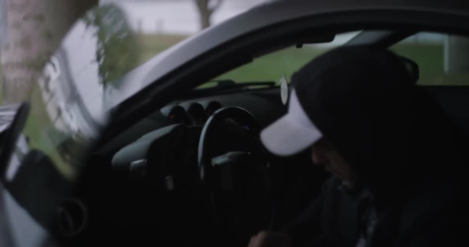 A man enters a sports car