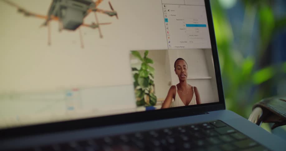 A woman talks on the laptop