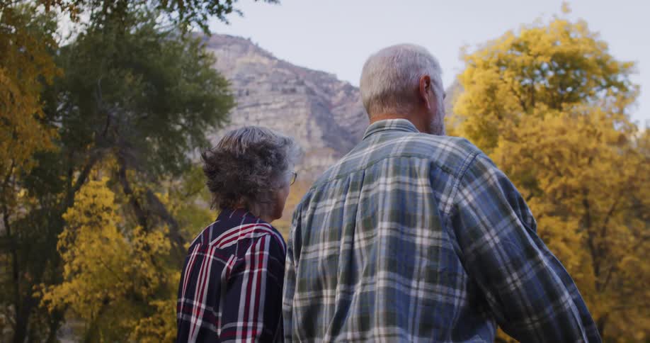 A man and woman hike outdoors