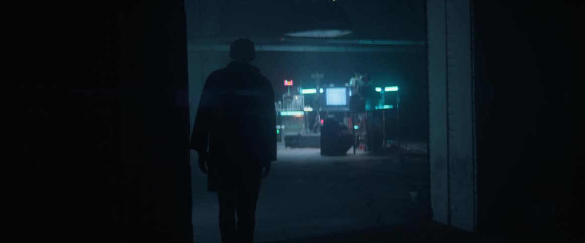 A man walks into the dark room