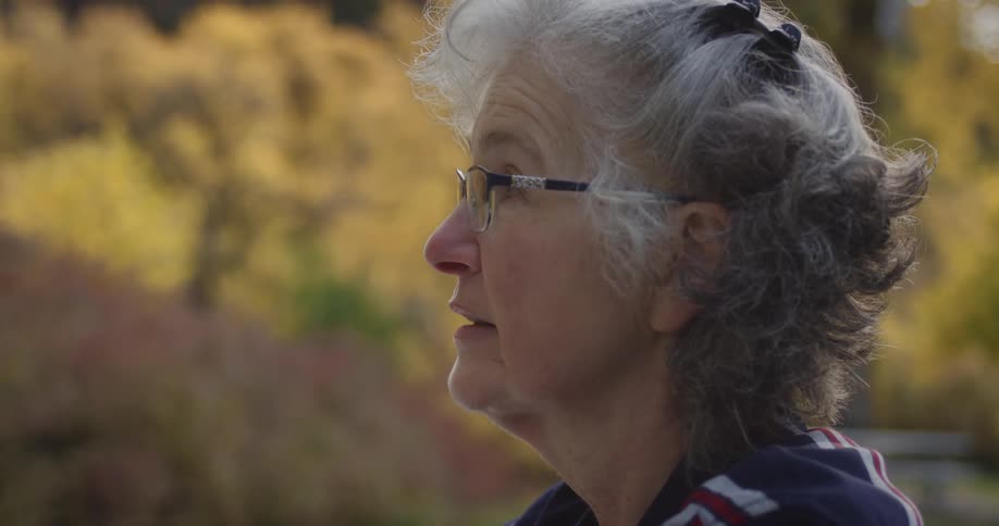 A woman standnig outdoors talking