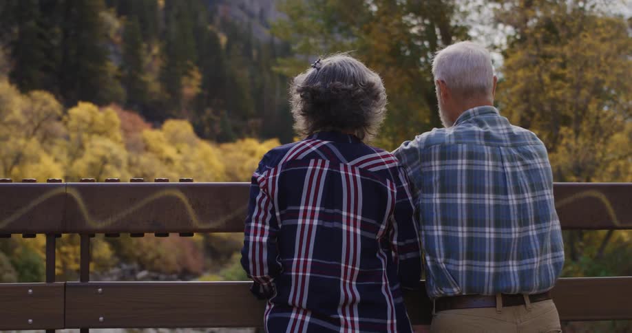 A view of a man and woman standing outdoors