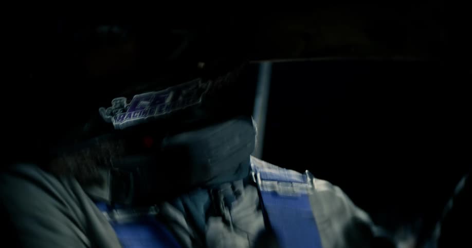 A race car driver turns around to reverse his vehicle