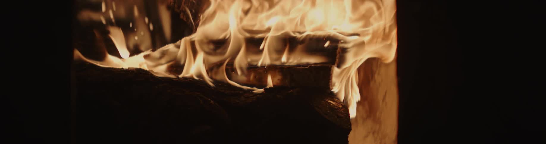 Flames are moving and wavering as a fire is burning brightly