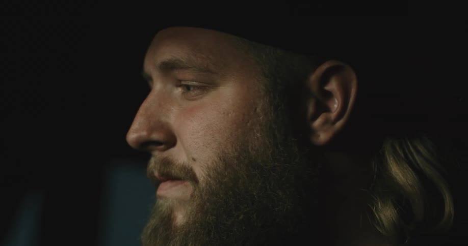 A man with a beard is just staring into the distance