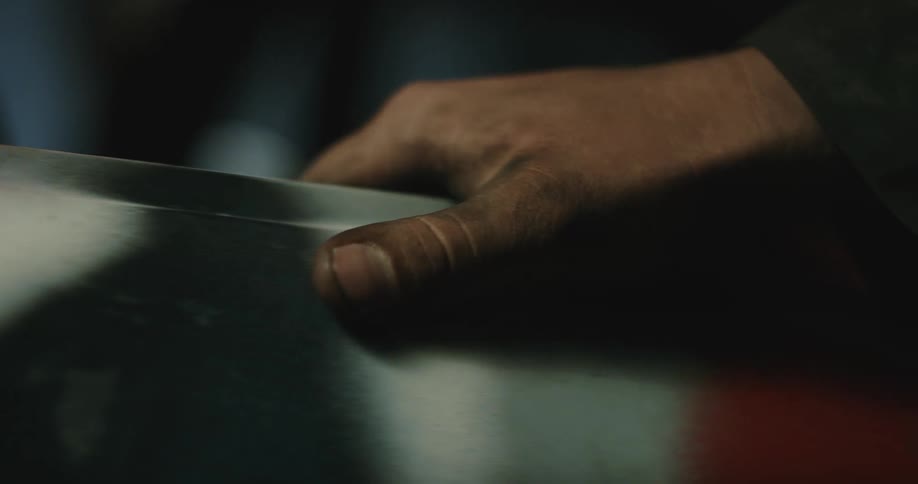 A man is touching an equipment with his hands