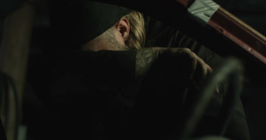 A man is working on the vehicle