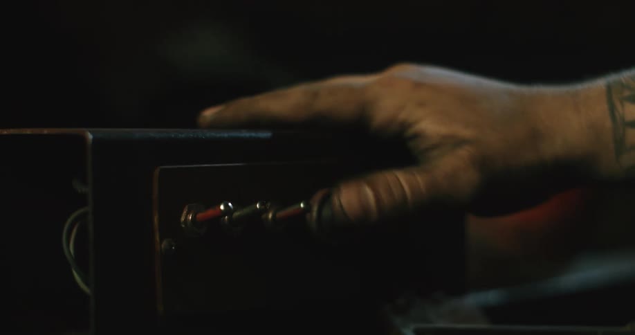 A person presses the switches on the device