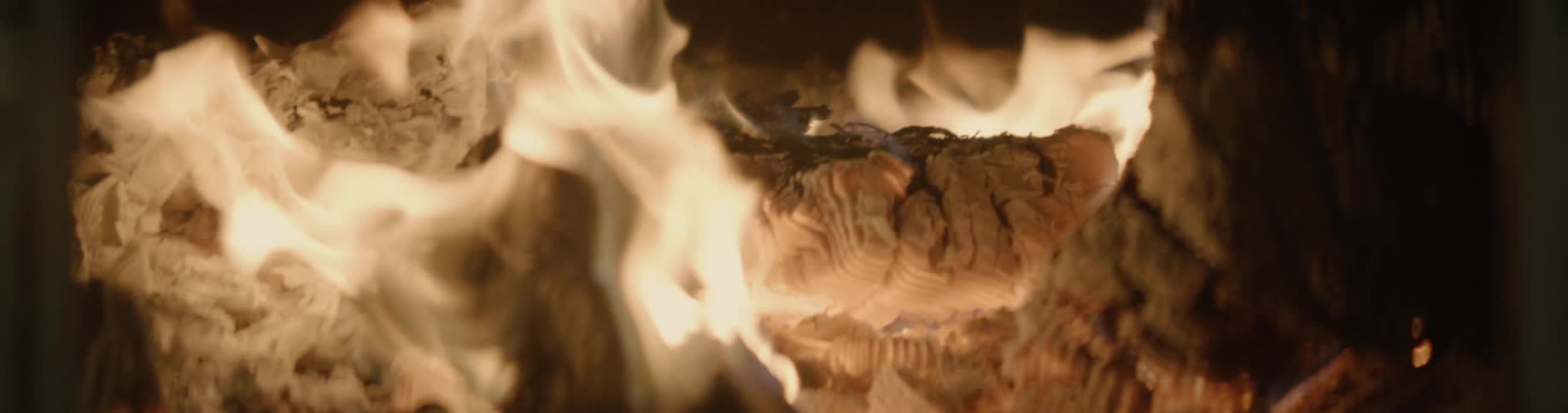 Flames are moving and wavering as a fire is burning brightly