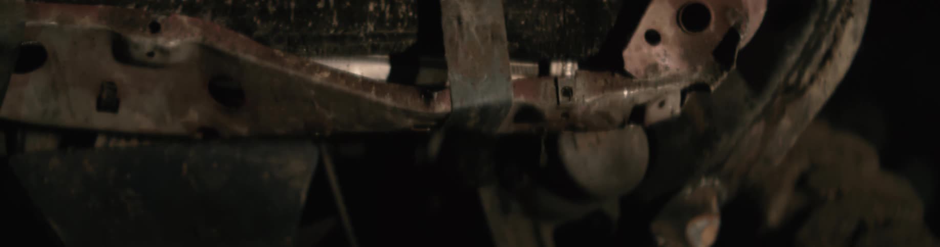 A vehicle is outside as it has water dripping from it