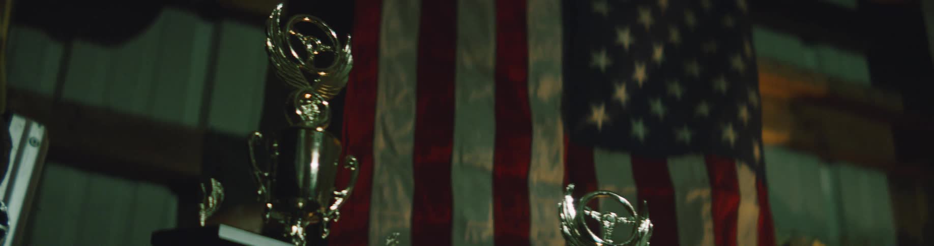 Trophies are on display by the flag