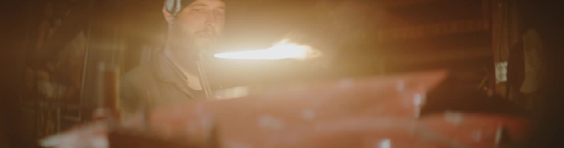 A person is inside fixing a car with some tools