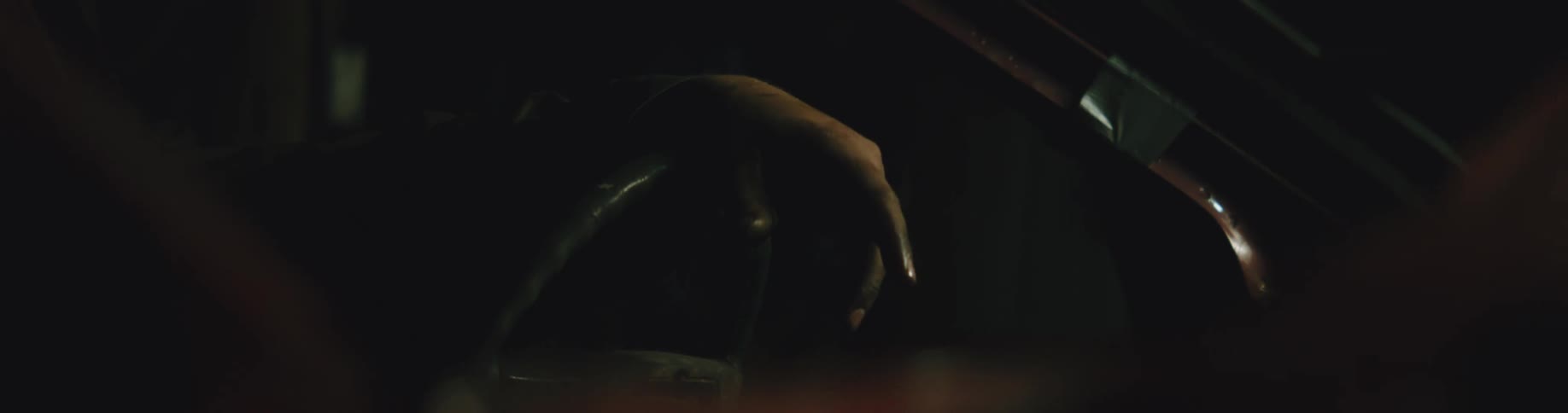A person is driving a car in the night time