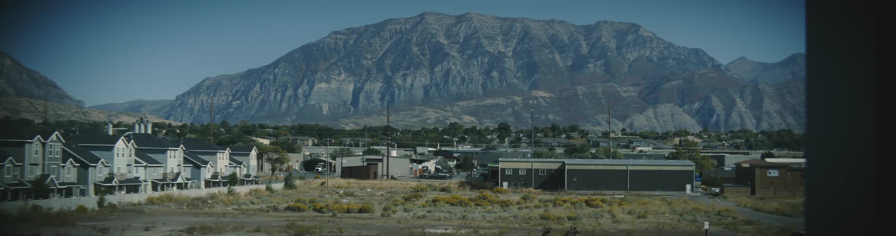 Homes at the bottom of a mountain range
