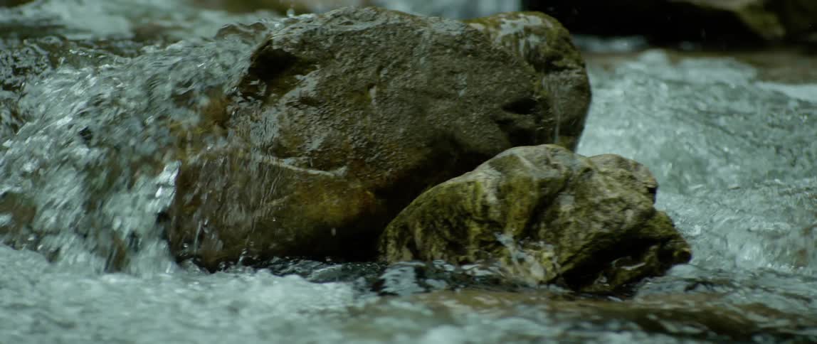 The water flows over the rocks