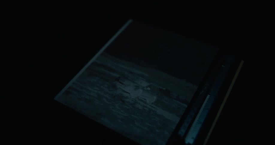 The lights go off showing a hidden negative image in a screen