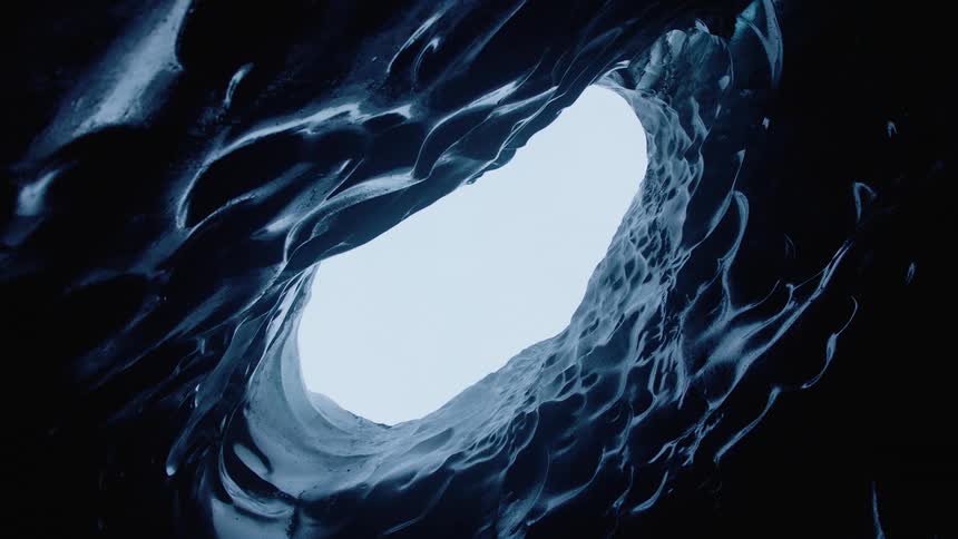 A bumpy cylindrical abstract shape reveals a hole at the top