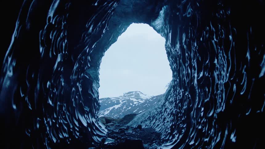 A view of mountains from a cave