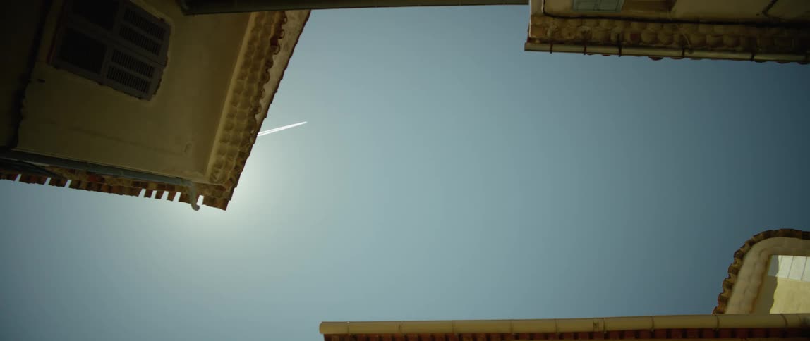 An airplane leaves a contrail as it travels overhead