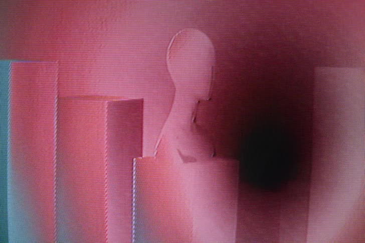 A mannequin form on a pedestal with flashing colorful lights