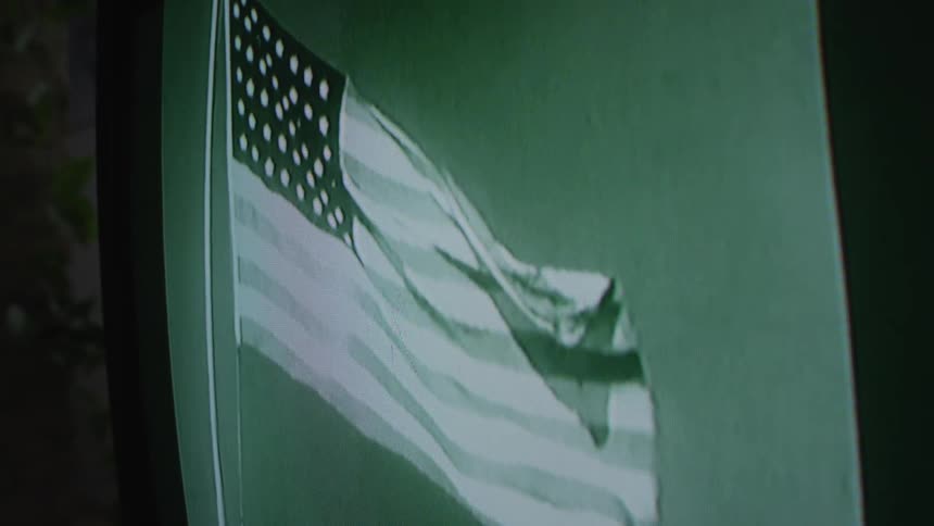The flag is waving on the television screen