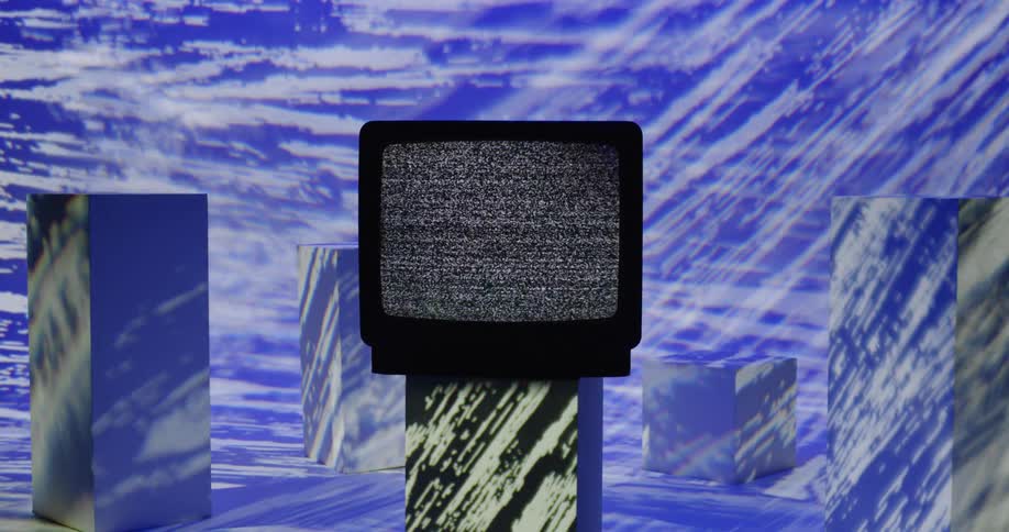 Static plays on a tube style television as graphics are flashed into the room
