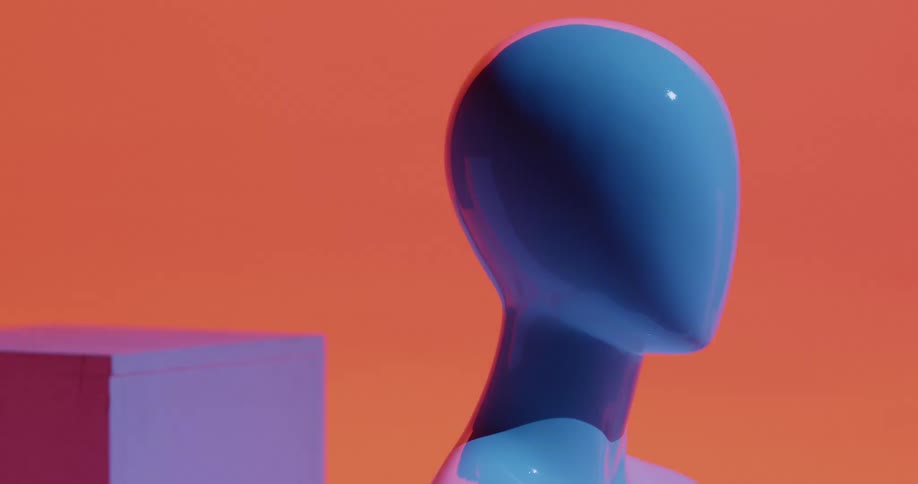 A mannequin of a female figure glows with different light