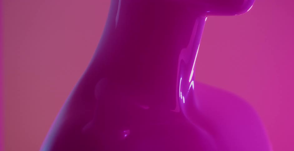 A figure of a woman is shiny with varying colors reflecting around her