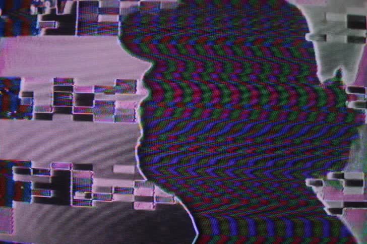 The man is pixelated with static all over