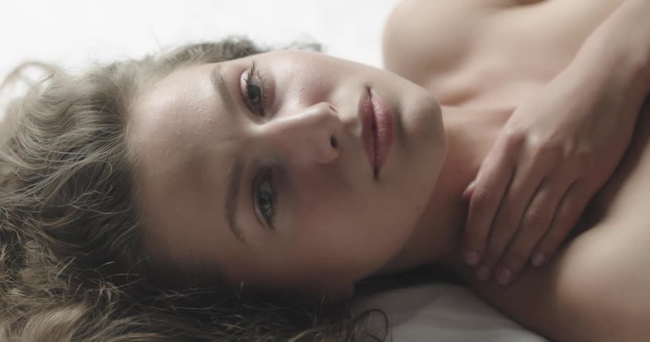 A woman is resting in bed