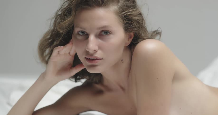 A woman is laying in bed