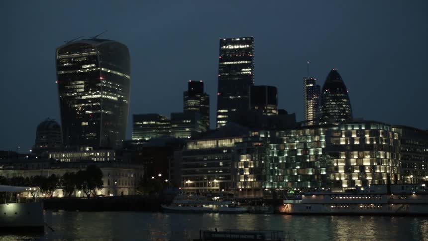 A city sits bright at night across the water