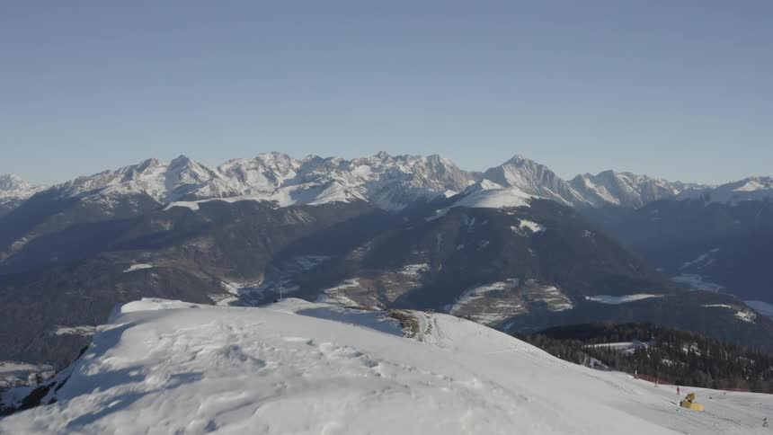 People are skiing on the mountain top