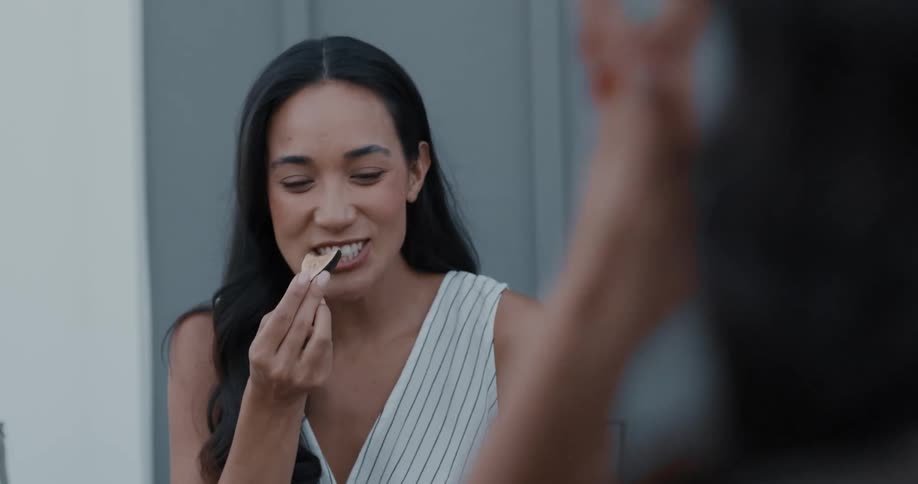 A woman is eating food with her friends