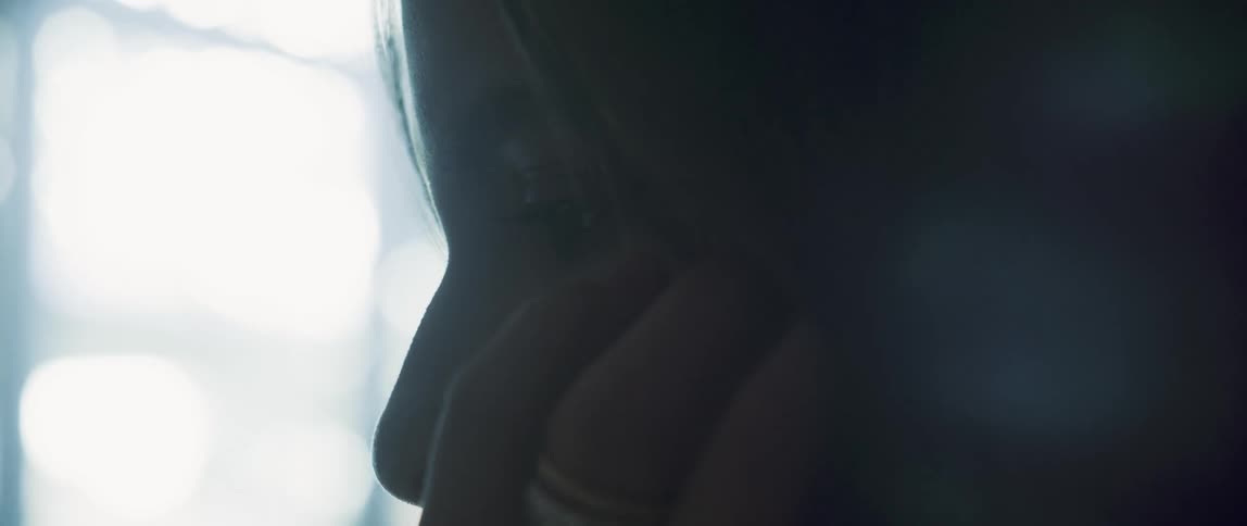Close up view of a womans face is displayed