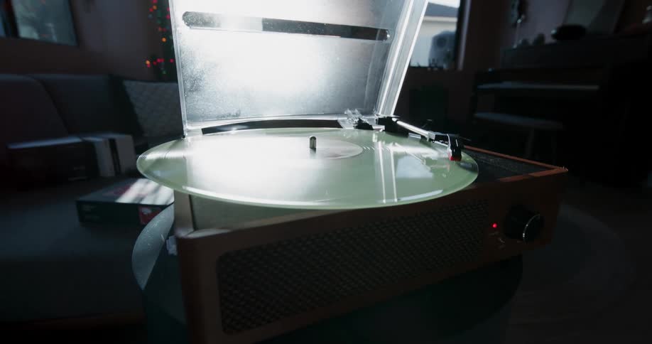 A vinyl album plays on a record player